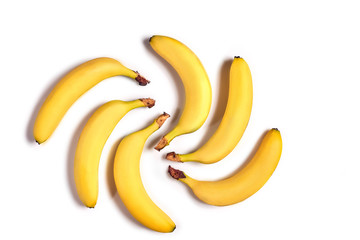 Ripe yellow bananas on a white background