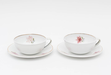 Old white enameled metal coffee cups