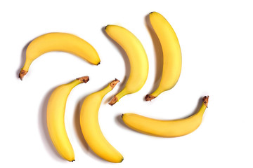 Ripe yellow bananas on a white background