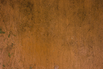 Wooden surface painted in orange rusty color, grunge background
