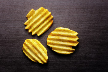 Chips potato on a black background