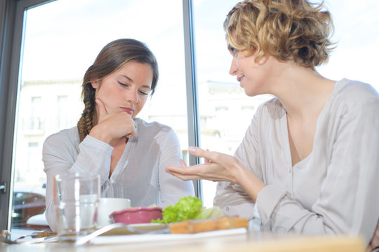 Women chatting over lunch