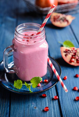Pomegranate smoothie in a glass jar