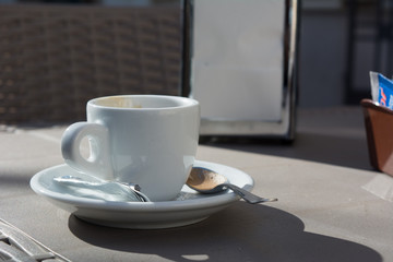 Horizontal View of Close Up of a Cup of Coffee On the Table of an Italian Bar