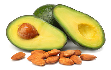 healthy food. sliced avocado with almonds isolated on white background