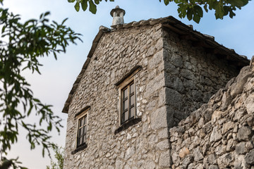 Traditional ancient house with  flagstone roof in the village of Pocitelj, Bosnia Herzegovina