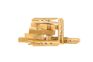 a lot of clothespins of bamboo on a white background