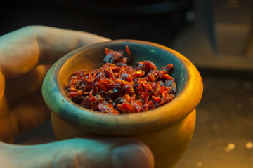 The process of cooking shisha, hookah bowl