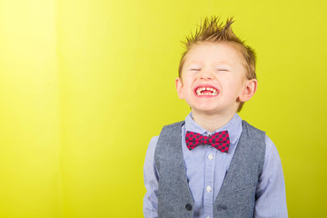 smiling child with shirt and bow tie