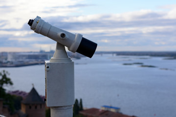 Big binoculars on the observation deck on the banks of the Volga river