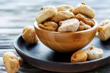 Sweet dried figs in a wooden bowl.