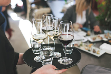 waitress at restaurant serving drink