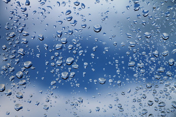 Raindrops on window glass , rainy day