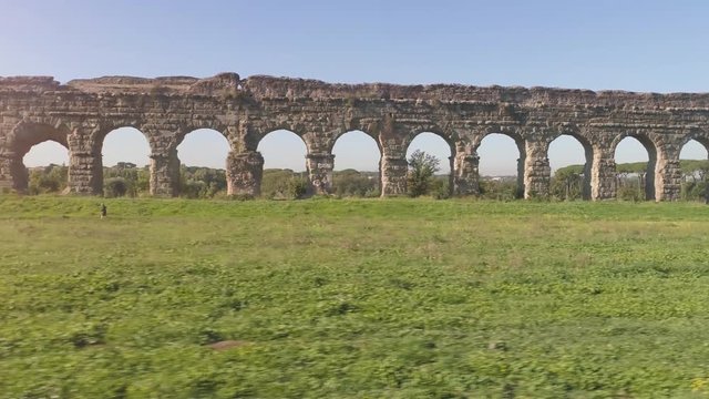 Aerial view of famous ancient roman aqueduct claudio landmark in parco degli acquedotti in rome drone slow motion dolly