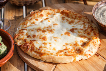 Traditional Georgian bread with cheese - khachapuri