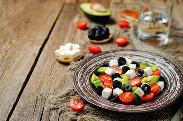 Avocado tomato black olives feta cheese salad