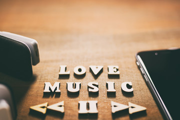 Relaxation music concept, smartphone black screen with bluetooth headphones, 