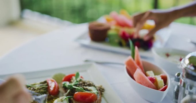 Couple enjoying beautiful healthy breakfast at luxury hotel
