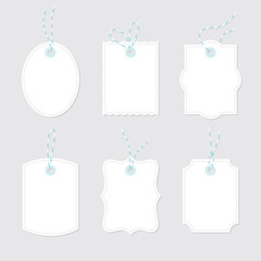 Blank price tags and gift cards tied up with twine bows and ribbons set. Paper labels of different shapes