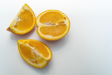 Naklejka na ściany i meble Sliced Orange On A White Background