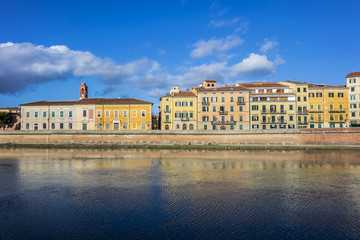 Fototapeta na wymiar Picturesque Arno River embankment with colorful old houses in Pisa. Pisa, Tuscany, Italy, Europe.
