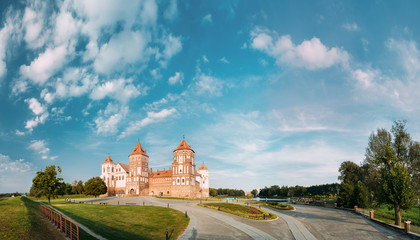Fototapeta premium Mir, Belarus. Mir Castle Complex On Blue Sunny Sunset Sky Background