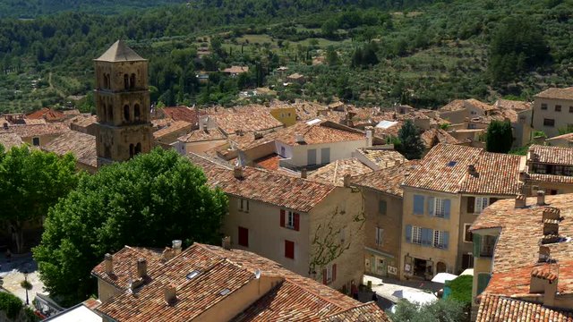 Panoramic view of the roofs and the belfry of the old town. Moustiers-Sainte-Marie, France. 4K, UHD