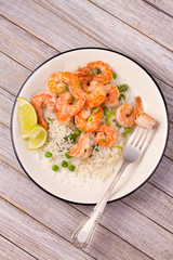 Shrimps with rice and peas. View from above, top, vertical