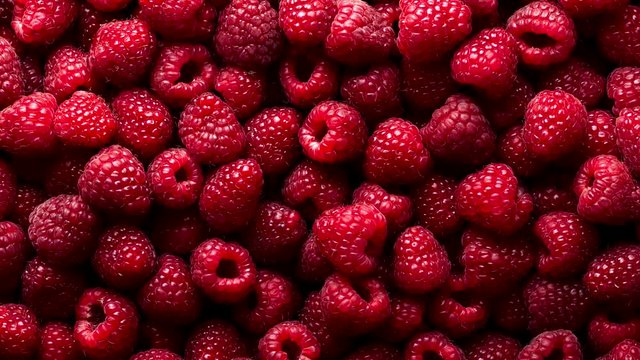 Background of ripe raspberries. Zoom out shot. 4K, UHD