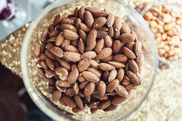 Top view of the almonds in the transparent bowl