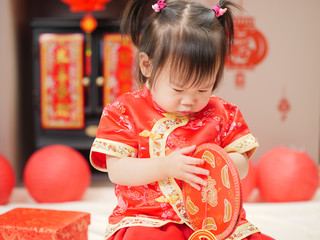 baby girl with traditional dressing up celebrate Chinese new year,