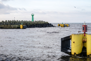 Seaport in Kołobrzeg. Breakwater, view of the lanterns seen from the shore.
