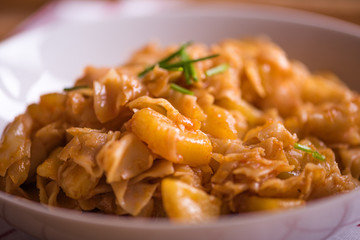 close up detail of eastern european traditional rustic dish from square pasta and cabbage 