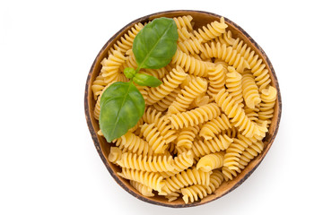 Uncooked fusilli pasta isolated white background.