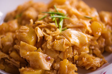 close up detail of eastern european traditional rustic dish from square pasta and cabbage 