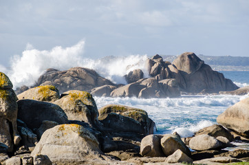 Big waves crashing on rocks coastline