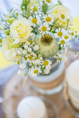 wedding floral arrangement on the table, meadow flowers for bride