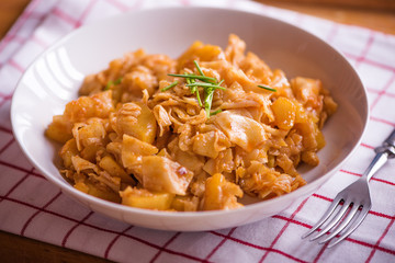 square pasta with cabbage and bacon traditional rustic dish in eastern Europe 