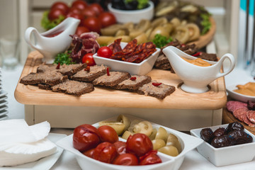 Hearty lard with garlic served with fresh bread on a table.