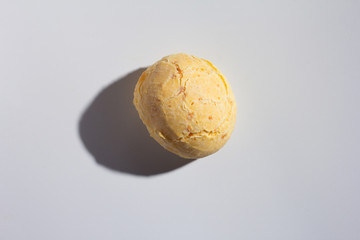 Fototapeta na wymiar Pao de Queijo is a cheese bread ball from Brazil. Also known as Chipa, Pandebono and Pan de Yuca. One snack over white background, minimalism.