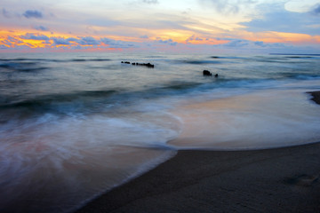 Fototapeta na wymiar Beautiful sunset over the sea on a long exposure