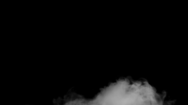 Fascinating close up slow motion view on white smoke steam cloud fog on dark black background
