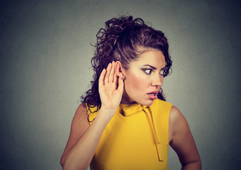 Concentrated woman listening to shocking rumors