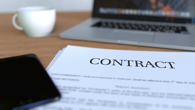 Copy of contract on the desk