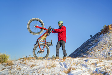 Fototapeta na wymiar fat bike riding in winter Colorado landscape