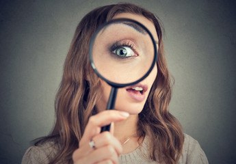 Woman looking through magnifier