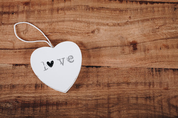 Wooden heart with "love" word written
