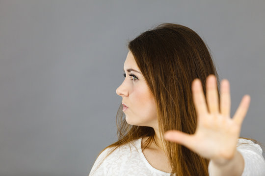 Angry apodicticity woman showing stop with hand