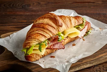 Zelfklevend Fotobehang Croissant sandwich with cheese and ham © Mara Zemgaliete