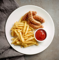 fried potatoes and sausages